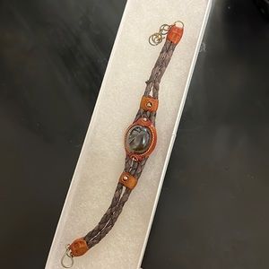 Bravely with a goldish brown gem